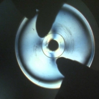 Анизотропное вещество между поляризаторами: болванка CD-диска